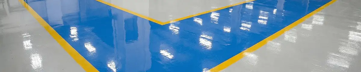 A factory floor professionally covered and marked with epoxy flooring in Glendale, AZ