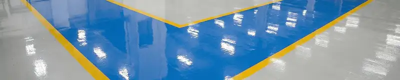 A factory floor professionally covered and marked with epoxy flooring in Glendale, AZ