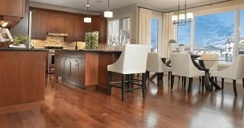 A modern kitchen with professionally installed wood flooring in Glendale, AZ