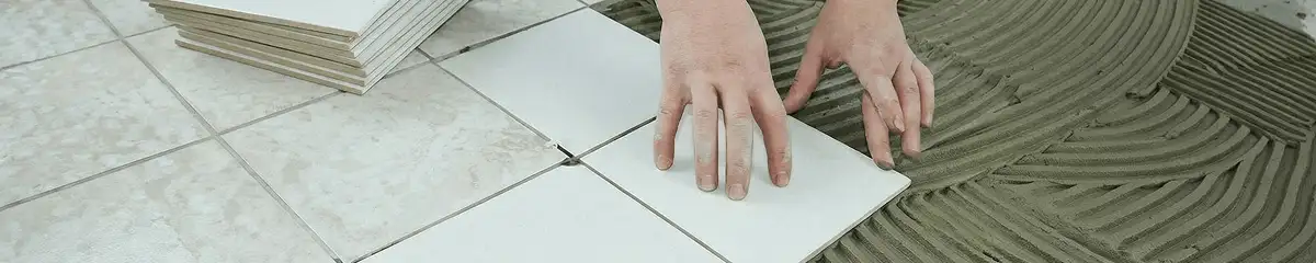 Professional installing white tile floors in Glendale, AZ